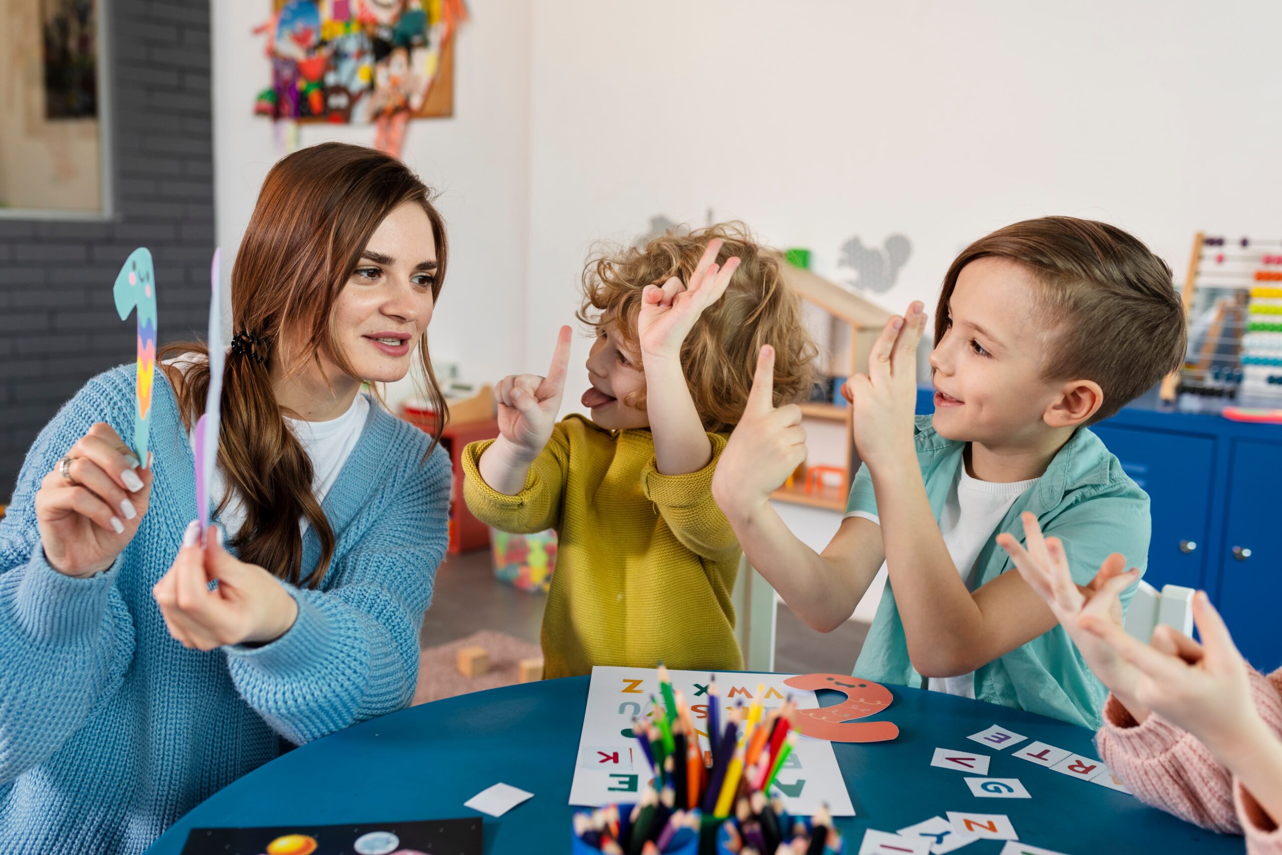 medium shot kids teacher table 3 scaled