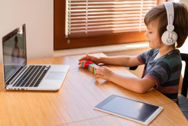 boy arranging some toys online classes 1