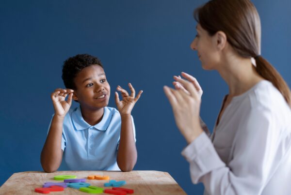 boy having occupational therapy session with psychologist 1