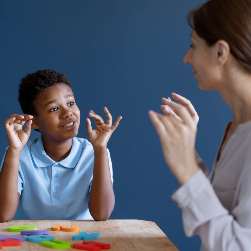 boy having occupational therapy session with psychologist 1