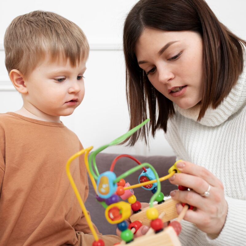 medium shot mother child with game 1