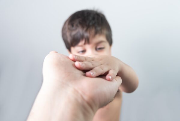 baby boy holding dad s hand 1