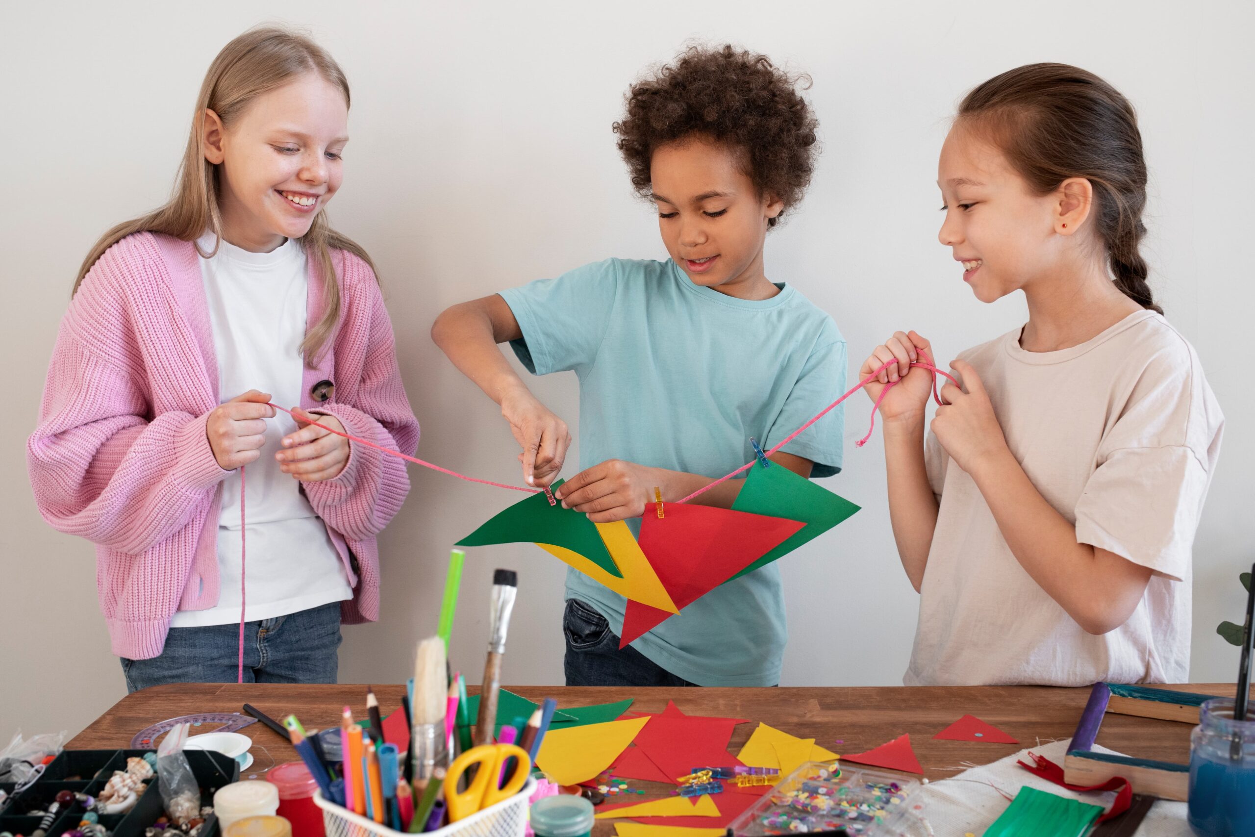 young kids making diy project from upcycled materials 1 scaled