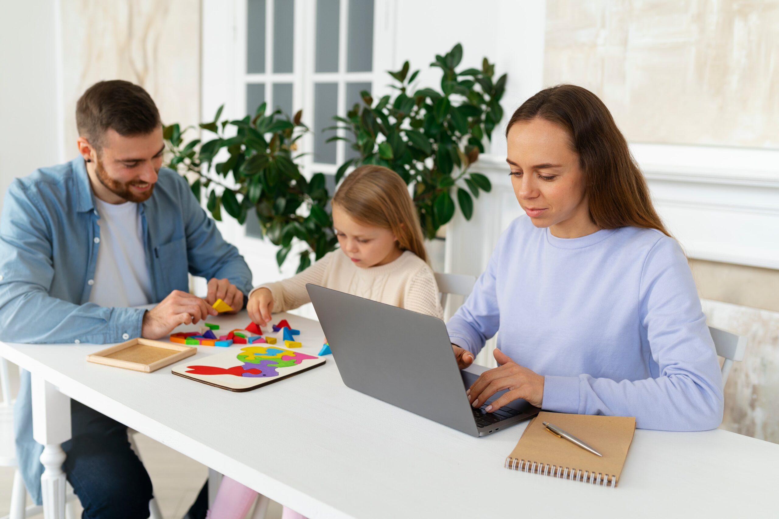 medium shot parents working remotely 1 scaled